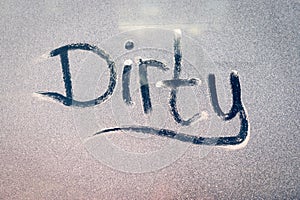 Dirty Text on a Grubby Dust Covered Window