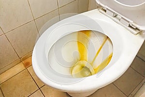 Dirty toilet bowl with limescale stain deposits photo