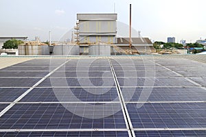 Dirty Unclean Solar Panels on Industrial Roof photo