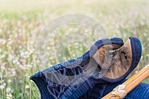 Dirty Used Kendo Kote Or Kendo Grove and Shinai On green grass ground, Warm tone