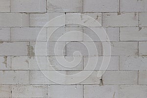 Dirty and weathered gray concrete brick wall background texture
