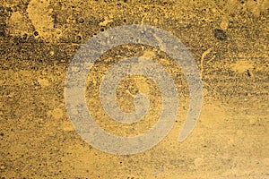 Dirty weathered yellow concrete wall texture background