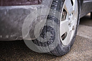 Dirty wheel of a car tire due to salt