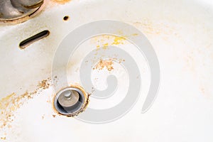 Dirty white ceramic sink.