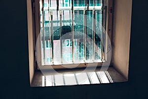 Dirty window with grates photo