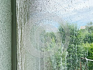 Dirty window after renovation dirtied with paint.