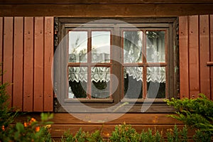 Dirty windows and shutters in the wooden house