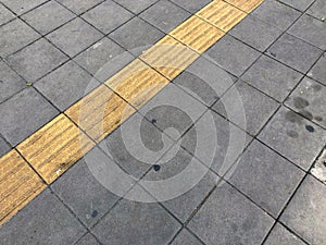 Dirty Yellow guiding block brick floor pattern