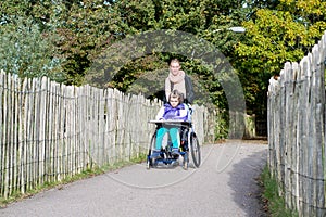 Disabled girl in a wheelchair relaxing outside