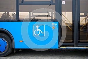 Disability and elderly person icon next to bus doors
