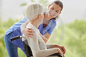 Disability healthcare, nurse and senior patient with support from medical worker in a wheelchair. Disabled elderly woman