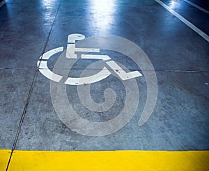 Disability sign in parking garage, underground