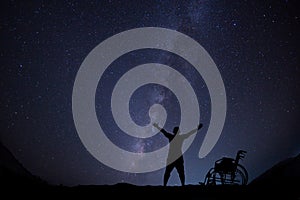 Disable man hope for freedom at night skyscape