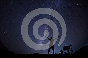 Disable man hope for freedom at night skyscape photo