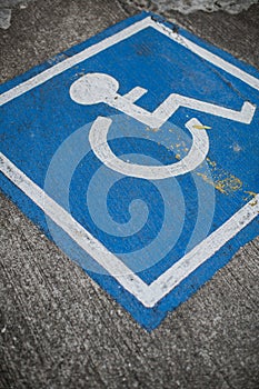 A disable sign on a street.