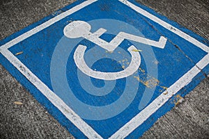 A disable sign on a street.