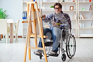 The disabled artist painting picture in studio