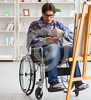 Disabled artist painting picture in studio