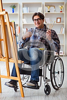 The disabled artist painting picture in studio