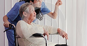 Disabled asian senior woman sitting in wheelchair.