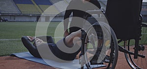 Disabled athlete doing sit ups