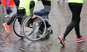Disabled athlete with the wheelchair during a sports competition photo