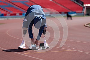 Disabled athletes prepare in starting position ready to run