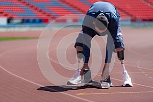 Disabled athletes prepare in starting position ready to run