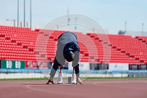 Disabled athletes prepare in starting position ready to run