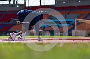 Disabled athletes prepare in starting position ready to run