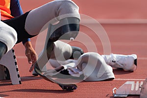 Disabled athletes prepare in starting position ready to run