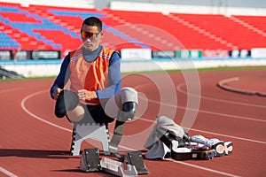 Disabled athletes prepare in starting position ready to run