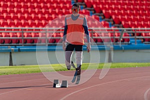 Disabled athletes prepare in starting position ready to run