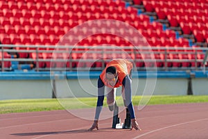 Disabled athletes prepare in starting position ready to run