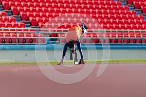 Disabled athletes prepare in starting position ready to run