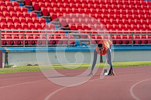 Disabled athletes prepare in starting position ready to run