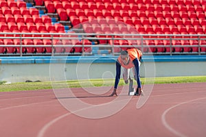 Disabled athletes prepare in starting position ready to run