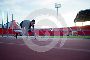 Disabled athletes prepare in starting position ready to run