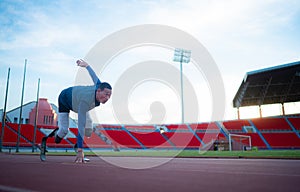 Disabled athletes prepare in starting position ready to run