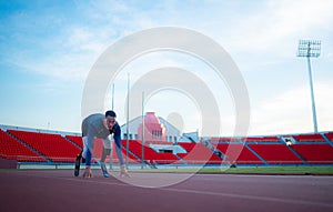 Disabled athletes prepare in starting position ready to run