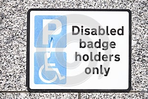 Disabled Badge Holders Only at Car Park Sign