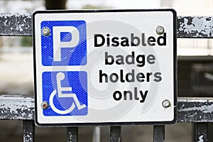 Disabled Badge Holders Only at Car Park Sign Post