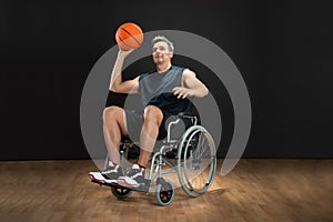 Disabled basketball player throwing ball