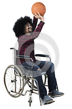 Disabled basketball player throwing a ball