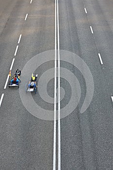 Disabled bike riders on the street. Urban mobility. Sport