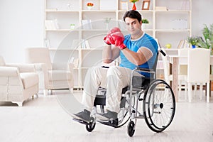 The disabled boxer at wheelchair recovering from injury