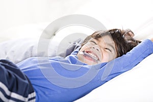 Disabled boy stretching happily