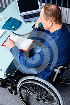 Disabled business in wheelchair