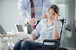 Disabled business woman with headache