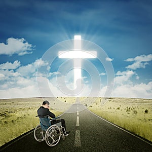 Disabled businessman praying on the road